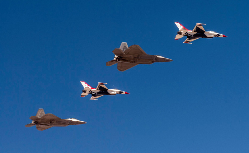 Illustration for article titled These Photos Of Thunderbirds F-16s Flying With F-22 Raptors Is A Whole Lot Of America